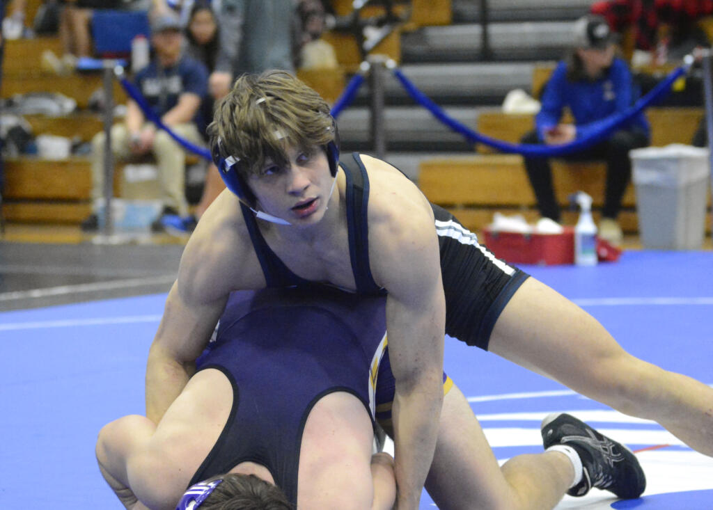 Skyview’s JJ Schoenlein looks toward his coaches on the corner of the mat for instruction in a in a 170-pound match on Saturday, Dec. 10, 2022, at the La Center Wildcat Wrestling Invitational.