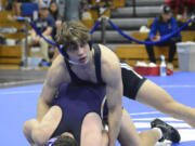 Skyview’s JJ Schoenlein looks toward his coaches on the corner of the mat for instruction in a in a 170-pound match on Saturday, Dec. 10, 2022, at the La Center Wildcat Wrestling Invitational.