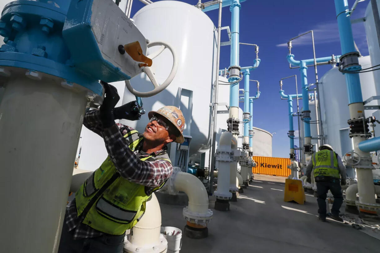 Sergio Lopez paints a filtration tank as construction continues at LADWP???s Tujunga Spreading Grounds facility, where groundwater from the San Fernando basin will be treated.