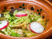 This Chicken Pozole Verde derives its flavor from poultry that's been simmered in a tangy sauce made from tomatillos, cilantro and green chilies.