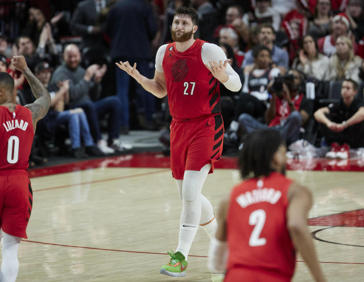 Portland Trail Blazers center Jusuf Nurkic (27) gestures after making a 3-point basket against the Charlotte Hornets during the second half of an NBA basketball game in Portland, Ore., Monday, Dec. 26, 2022.