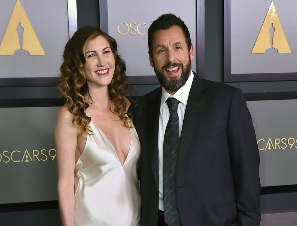 FILE - Jackie Sandler, left, and her husband Adam Sandler appear at the Governors Awards on Nov. 19, 2022 in Los Angeles.