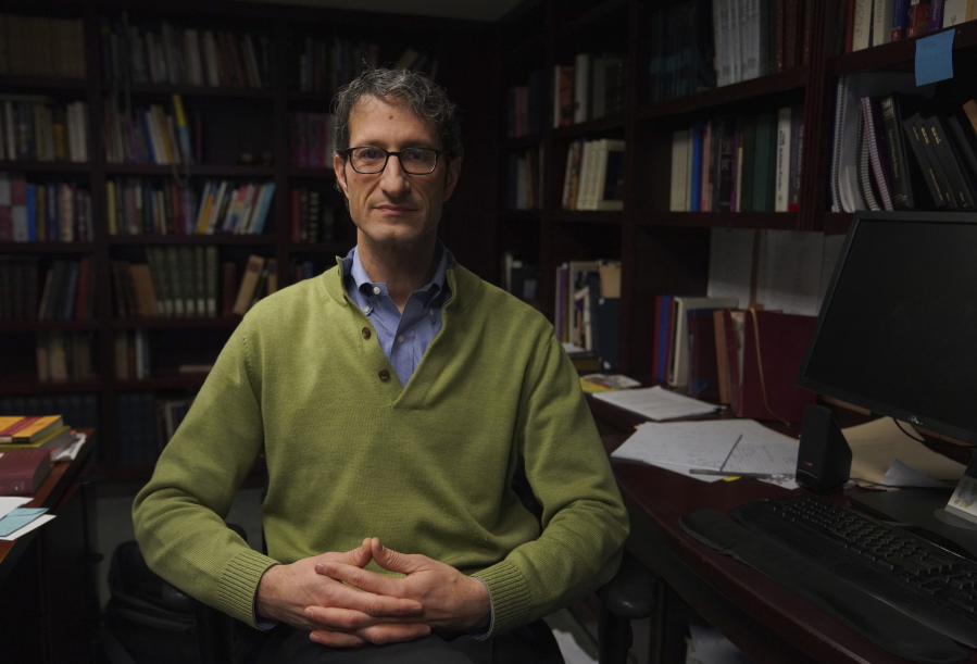 Senior Rabbi Seth Adelson sits for a portrait in his office at Congregation Beth Shalom in the Squirrel Hill neighborhood of Pittsburgh on Tuesday, Dec. 6, 2022.