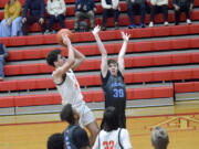 Battle Ground's Tait Spencer shoots the ball over Liberty's Lucas Whitbey (30) during the Tigers' 88-68 win at the Fort Vancouver Holiday Classic on Wednesday, Dec. 28, 2022.