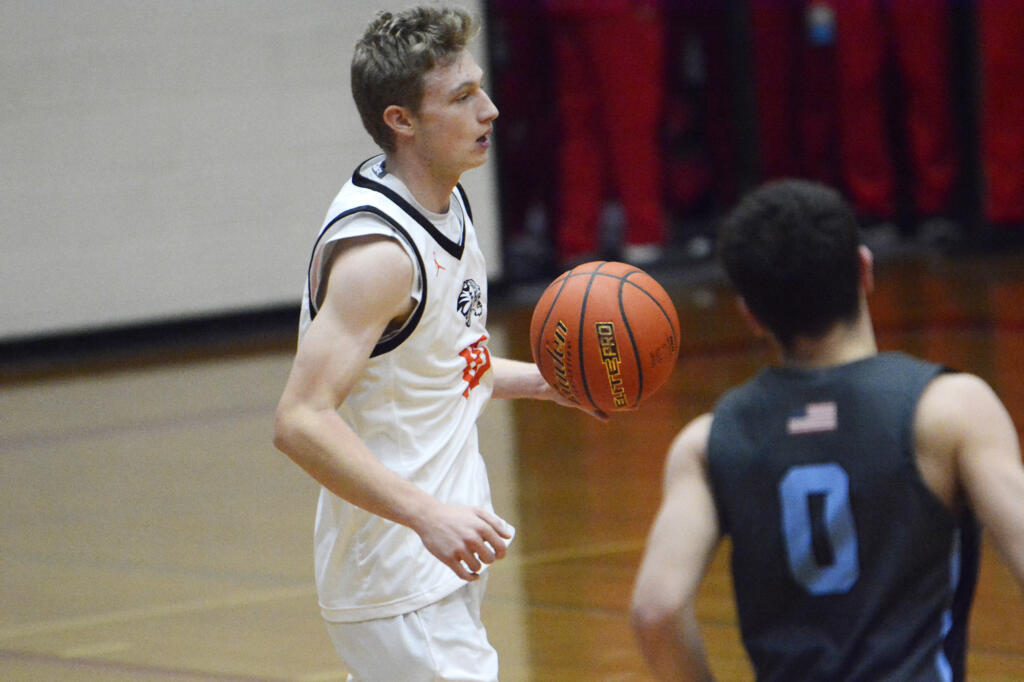 Battle Ground's Ty Robertson brings the ball upcourt during the Tigers' 88-68 win over Liberty (Ore.) at the Fort Vancouver Holiday Classic on Wednesday, Dec. 28, 2022.