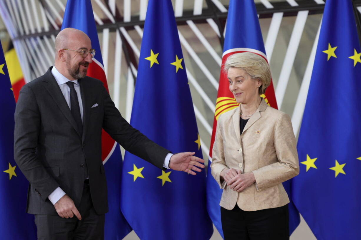 European Commission President Ursula von der Leyen, right, and European Council President Charles Michel speak as they wait for the arrival of leaders for the EU-ASEAN summit in Brussels, Wednesday, Dec. 14, 2022. EU and ASEAN leaders meet in Brussels for a one day summit to discuss the EU-ASEAN strategic partnership, trade relations and various international topics.