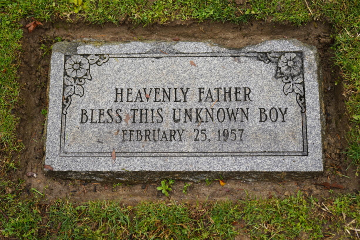 The marker of the grave of a small boy whose battered body body was found abandoned in a cardboard box decades ago in Philadelphia is seen Wednesday, Dec. 7, 2022. Nearly 66 years after the boy was found Philadelphia police are set to reveal the identity of the victim in the city's most notorious cold case. Police say detective work and DNA analysis helped them learn the name of a youngster who'd been known to generations of Philadelphians as the "Boy in the Box." Authorities are set to publicly release the victim's name Thursday. His naked, badly bruised body was found in a wooded area on Feb. 25, 1957.