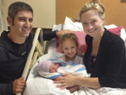 Amy Bianchi of Albany, N.Y., with her newborn son, Brayden, with his father, Christopher, and sister, Mia, at Bellevue Woman's Center in Niskayuna, N.Y., in 2018.