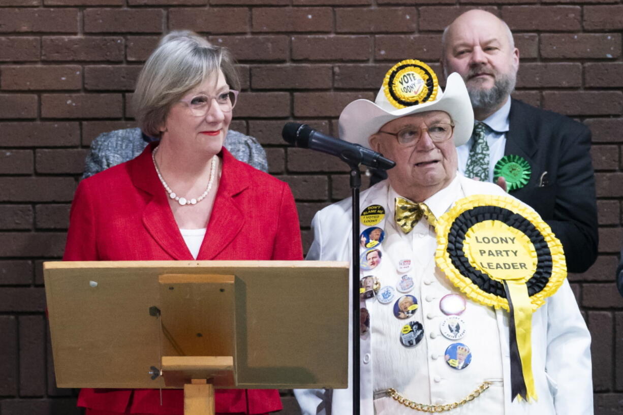 Labour Samantha Dixon, left, makes a speech after winning the Chester by-election following the count at Northgate Arena Leisure Centre in Chester, England Friday Dec. 2, 2022. The by-election is to replace former Labour MP Christian Matheson who resigned after complaints of "serious sexual misconduct" were upheld by a parliamentary watchdog.