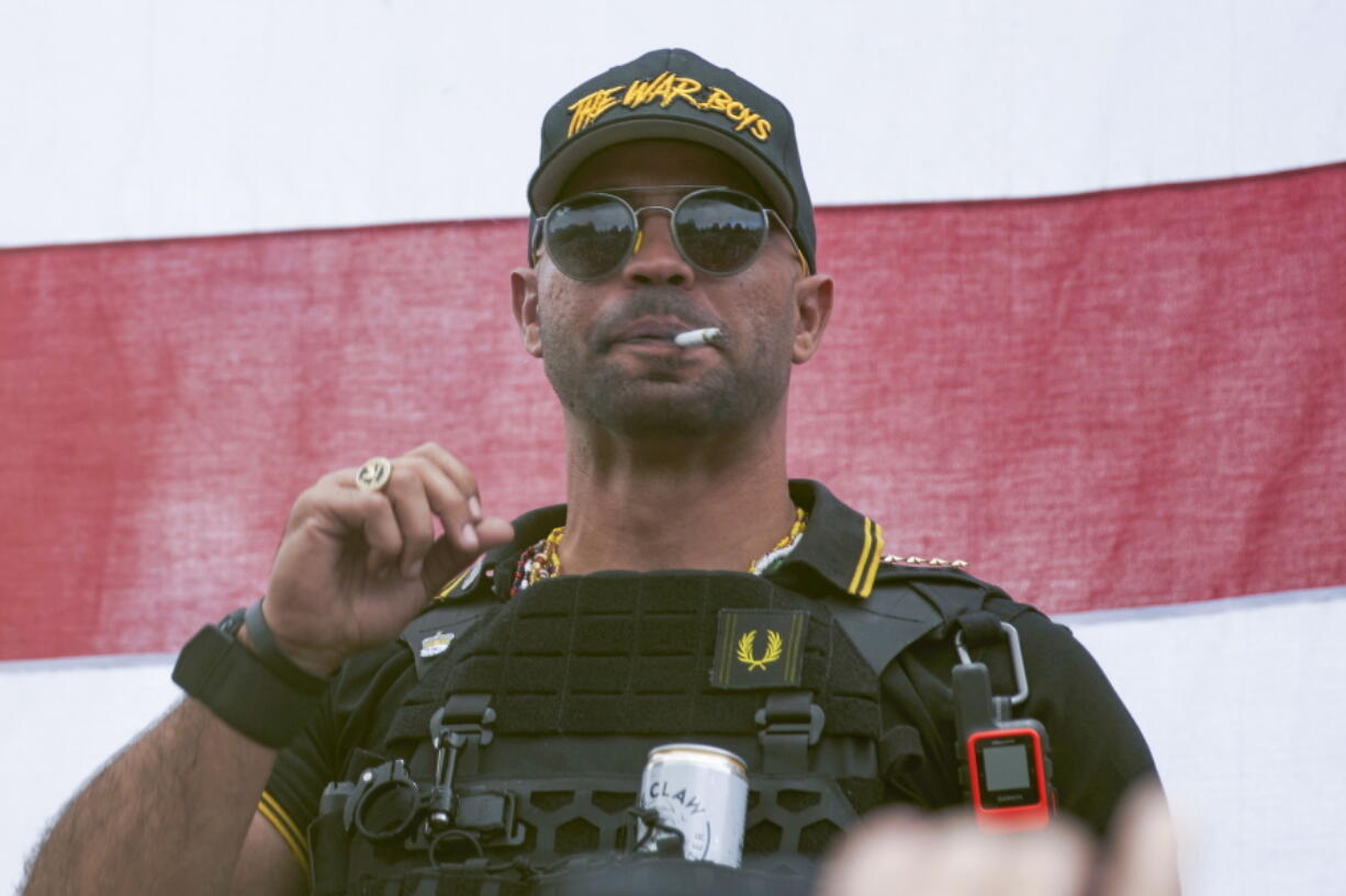 FILE - Proud Boys leader Henry "Enrique" Tarrio wears a hat that says The War Boys during a rally in Portland, Ore., on Sept. 26, 2020. Jury selection will get underway Monday, Dec. 19, in the seditious conspiracy trial of former Proud Boys national chairman Enrique Tarrio and four other members of the extremist group accused of plotting to attack the U.S. Capitol on Jan. 6, 2021, in a desperate bid to overturn President Joe Biden's victory.