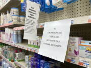 A sign is placed near the section for children's medicine, Sunday, Dec. 18, 2022 at a CVS in Greenlawn, N.Y. Caring for a sick child has become even more stressful than usual for many U.S. parents in recent weeks due to shortages of Children's Tylenol and other medicines.