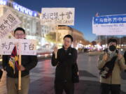 People protest at Freedom Plaza in Washington, Sunday, Dec. 4, 2022, in solidarity with the ongoing protests against the Chinese government's continued zero-COVID policies.