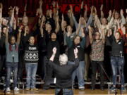 Bill Loper, interim artistic director of the Out Loud Colorado Springs Men's Chorus, leads the group during a rehearsal for its Christmas program in Colorado Springs, Colo., on Wednesday, Nov. 30, 2022. Gay and lesbian choruses like Out Loud came about after the assassination of San Francisco Supervisor Harvey Milk and have remained steadfast institutions through the civil rights struggles of the 20th century up to today. They've taken an active role in the healing process after mass shootings like that at Orlando's Pulse nightclub and the Nov. 19 attack at an LGBTQ nightclub in Colorado Springs that killed five people.