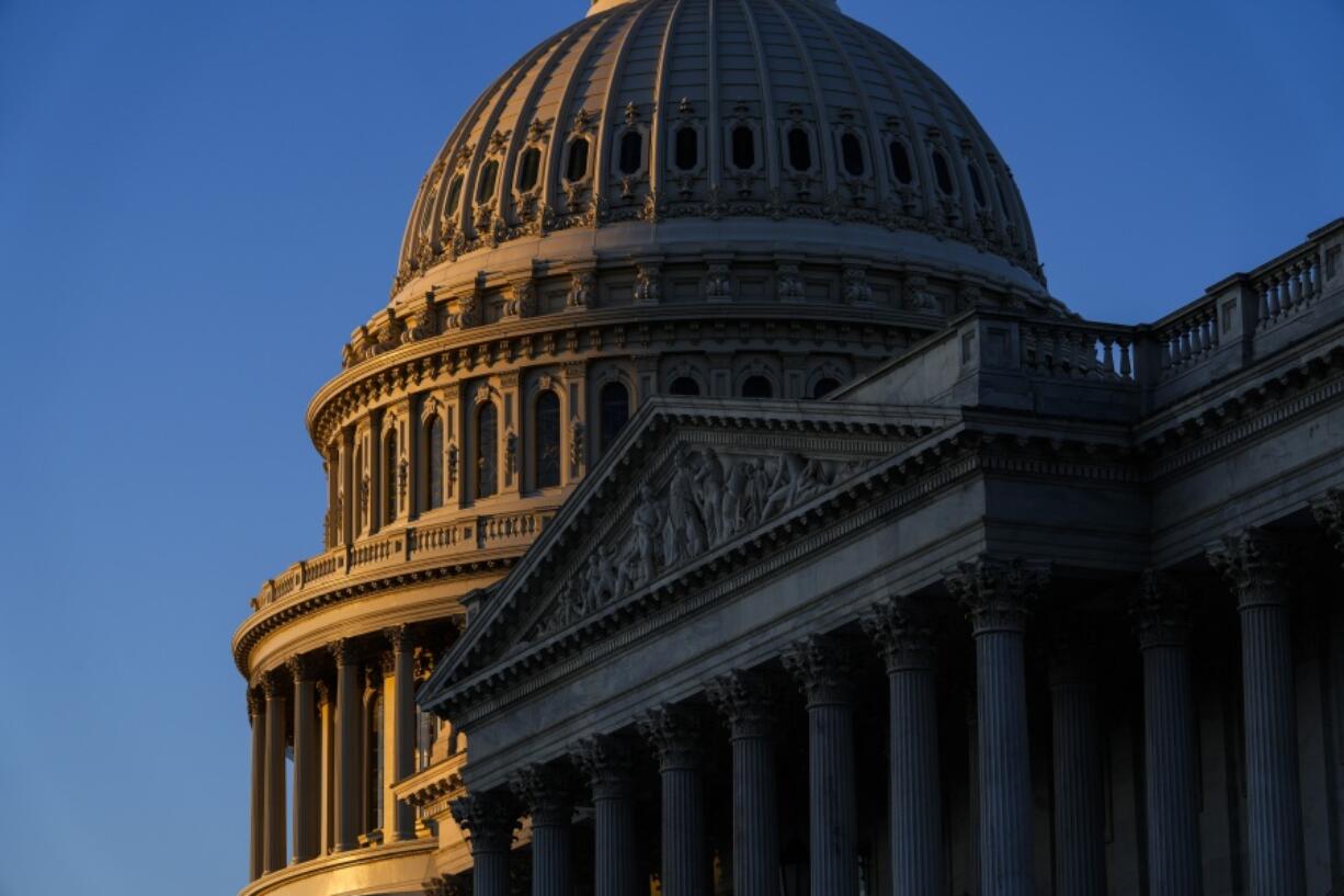 FILE - Sunrise at the U.S. Capitol, Monday, Dec. 19, 2022 in Washington.  The House and the Senate are set to pass an overhaul of the Electoral Count Act, the arcane election law that then-President Donald Trump tried to subvert after his 2020 election defeat. Democrats and Republicans have been working on the legislation since the Jan. 6, 2021, insurrection at the Capitol, where Trump supporters echoing his false claims of widespread election fraud interrupted the congressional certification of Democrat Joe Biden's victory.