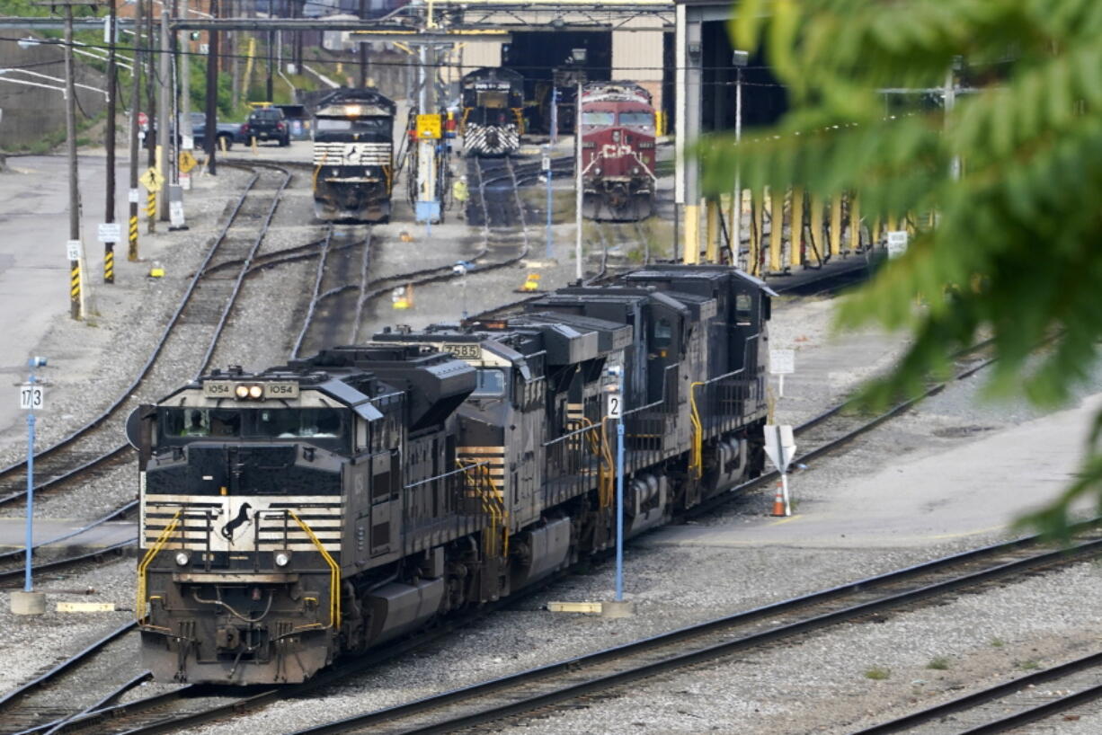 FILE - Norfolk Southern locomotives are moved in the Conway Terminal in Conway, Pa., Thursday, Sept. 15, 2022. On Thursday the Commerce Department issues its third and final estimate of how the U.S. economy performed in the second quarter of 2022. By Matt Ott.(AP Photo/Gene J.