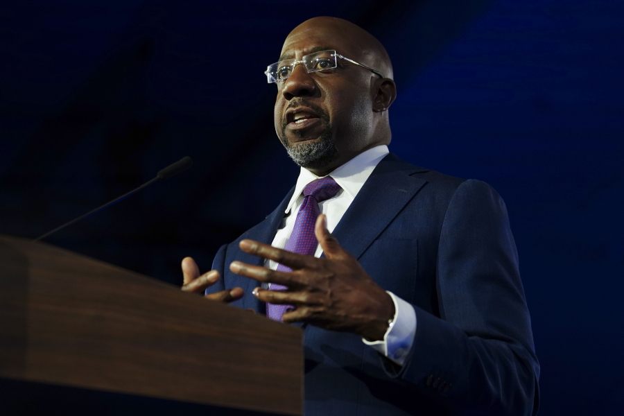 Democratic Sen. Raphael Warnock speaks during an election night watch party, Tuesday, Dec. 6, 2022, in Atlanta. Democratic Sen. Raphael Warnock has defeated Republican challenger Herschel Walker in a runoff election in Georgia.