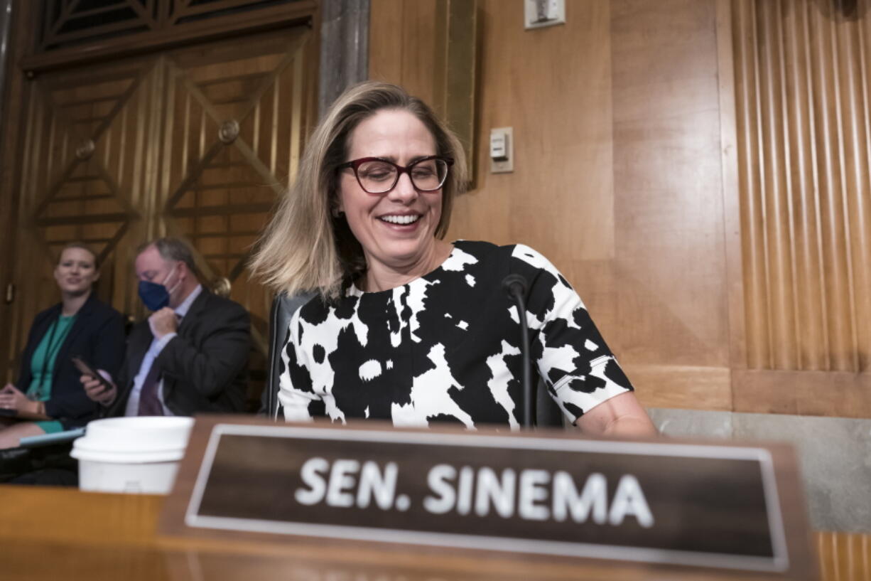 FILE - Sen. Kyrsten Sinema, D-Ariz., arrives for a meeting of the Senate Homeland Security Committee at the Capitol in Washington, Aug. 3, 2022. The decision by Sinema to leave the Democratic Party raised the prospect of a tumultuous three-way race in one of the most politically competitive states in the U.S. It set off a scramble among potential Democratic and Republican candidates to assess whether they could win their party's nomination. (AP Photo/J.