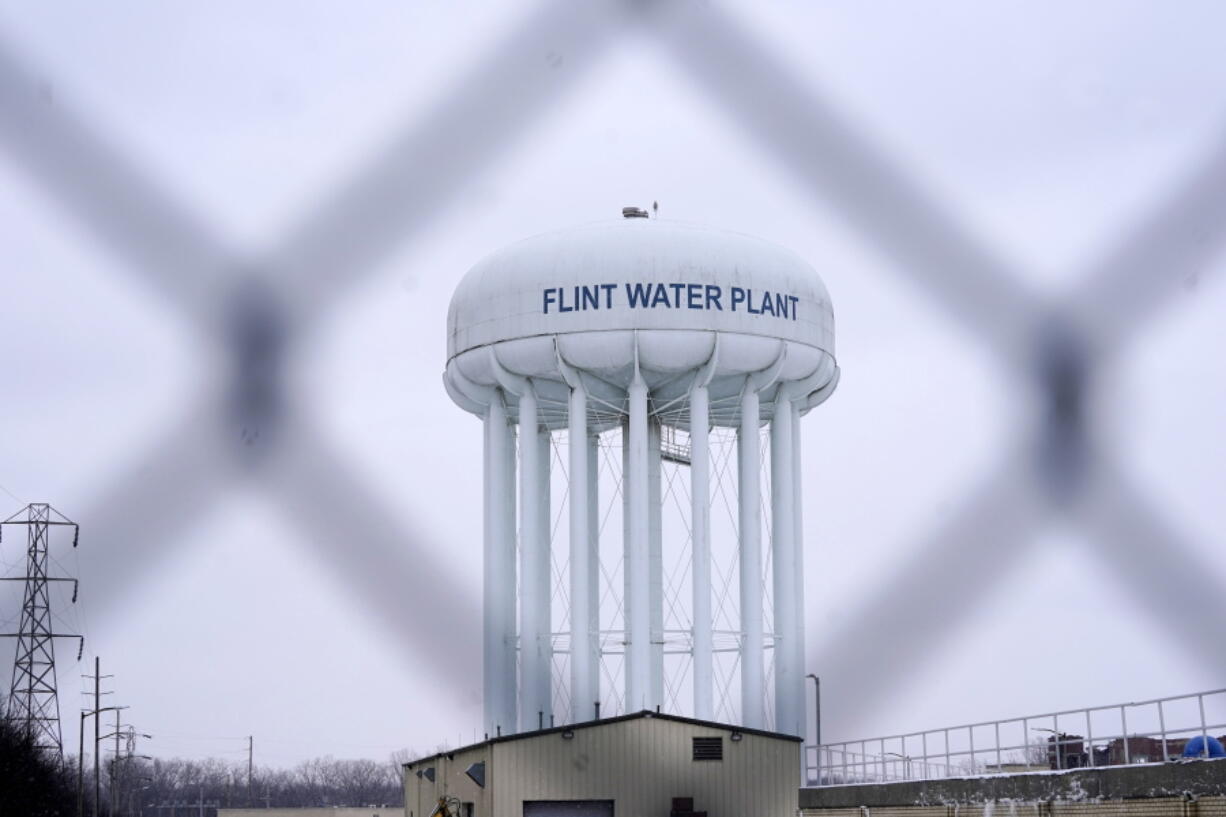 FILE - The Flint water plant tower is pictured on Jan. 6, 2022, in Flint, Mich. A judge dismissed criminal charges against former Michigan Gov. Rick Snyder in the Flint water crisis, months after the state Supreme Court said indictments returned by a one-person grand jury were invalid.