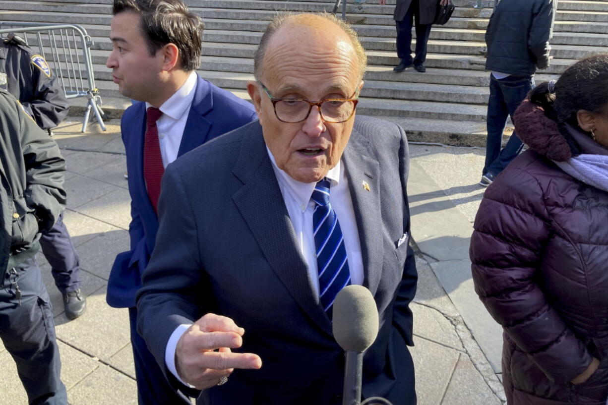 Former New York City mayor Rudy Giuliani speaks to reporters after a court hearing, Monday, Dec. 12, 2022, in New York. Rudy Giuliani beat a contempt order and avoided jail in an ongoing dispute over money he owes to his ex-wife, Judith Giuliani, as part of their 2019 divorce settlement.