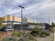 FILE - The exterior of a Google data center is pictured in The Dalles, Ore., on Oct. 5, 2021. Residents of The Dalles should soon know how much of their water Google's data centers there have been using to cool the computers, after a lawsuit seeking to keep the information confidential was dropped. Data centers around the world help people stream movies, store trillions of photos and conduct daily business online, but a single facility can churn through millions of gallons of water per day.