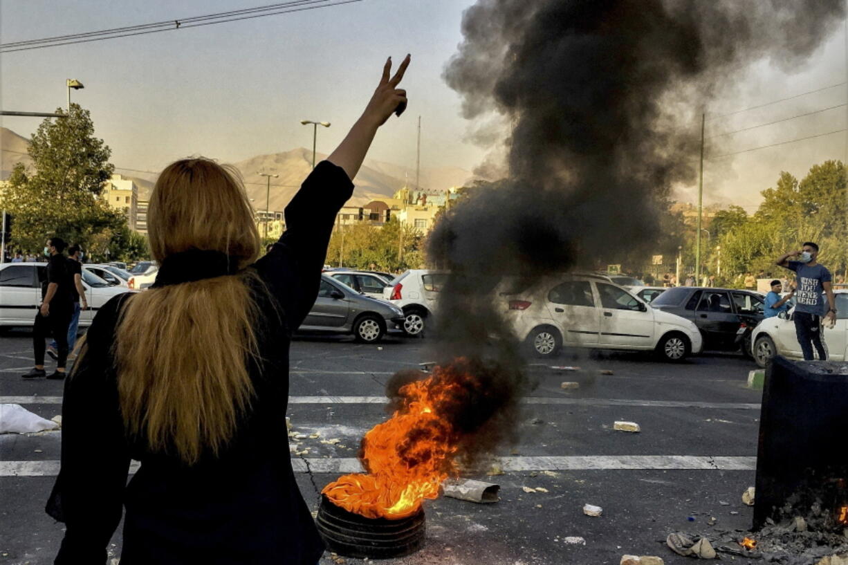 FILE - In this photo taken by an individual not employed by the Associated Press and obtained by the AP outside Iran, Iranians protests the death of 22-year-old Mahsa Amini after she was detained by the morality police, in Tehran, Oct. 1, 2022. In a report published by The Iranian student news agency, Nezamoddin Mousavi, an Iranian lawmaker said Sunday, Dec. 4, 2022, that Iran's government was ''paying attention to the people's real demands,'' a day after another key official announced that the country's religious police force had been closed following months of deadly anti-government protests.