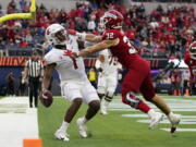 Fresno State defensive back Evan Williams (32) tackles Washington State quarterback Cameron Ward (1) in the end zone for a safety during the first half of the LA Bowl in Inglewood, Calif., Saturday, Dec. 17, 2022.