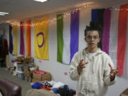 Sean Fisher, one of the student coordinators for QPLUS, the LGBTQ student organization for the College of Saint Benedict and Saint John's University, stands in the organization's dedicated lounge on the college's campus in St. Joseph, Minn., on Tuesday, Nov. 8, 2022. To Fisher, a senior in environmental studies who identifies as non-binary, the Catholic colleges' recognition and funding of the organization represents a new era.