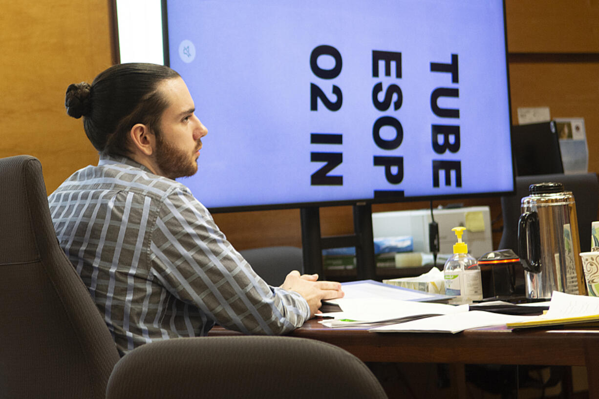 Elijah I. Partida, 24, listens to his defense attorney deliver closing arguments Nov. 17 to a Clark County Superior Court jury in his murder and manslaughter trial. Partida was accused of causing his infant daughter's fatal brain injuries in 2020. The jury convicted him of second-degree manslaughter.