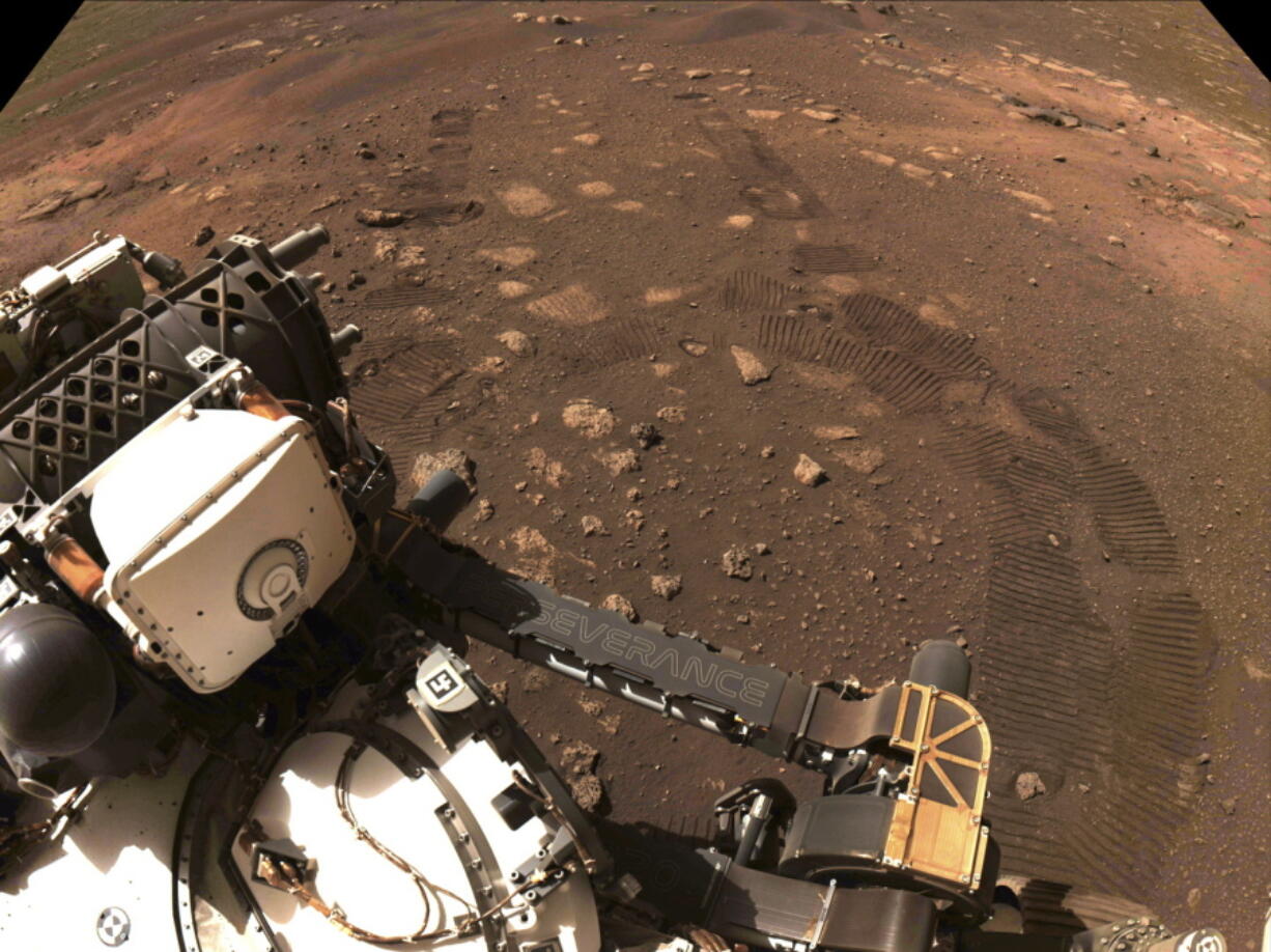 FILE - This photo made available by NASA was taken during the first drive of the Perseverance rover on Mars on March 4, 2021. A NASA rover on Mars by chance had its microphone on when a whirling tower of red dust passed overhead and caught the sound. Scientists released the first-of-its-kind audio Tuesday, Dec. 13, 2022.