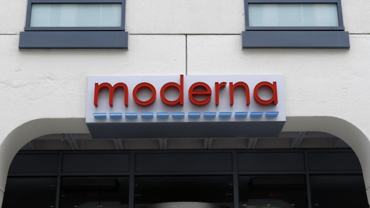 FILE - A sign marks an entrance to a Moderna building in Cambridge, Mass., on Monday, May 18, 2020.  Shares of Merck and Moderna jumped early Tuesday, Dec. 13, 2022,  after the drugmakers said a potential skin cancer vaccine they are developing using the same technology behind COVID-19 preventive shots did well in a mid-stage study.