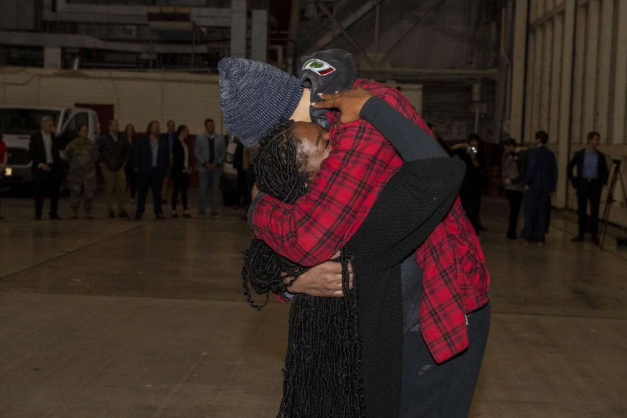 This photo provided by the U.S. Army shows WNBA star Brittney Griner, right, being greeted by wife Cherelle after arriving at Kelly Field in San Antonio following her release in a prisoner swap with Russia, Friday, Dec. 9, 2022. Griner said she's "grateful" to be back in the United States and plans on playing basketball again next season for the WNBA's Phoenix Mercury a week after she was released from a Russian prison and freed in a dramatic high-level prisoner exchange. "It feels so good to be home!" Griner posted to Instagram on Friday, Dec. 16, 2022, in her first public statement since her release. (Miquel A. Negro/U.S.