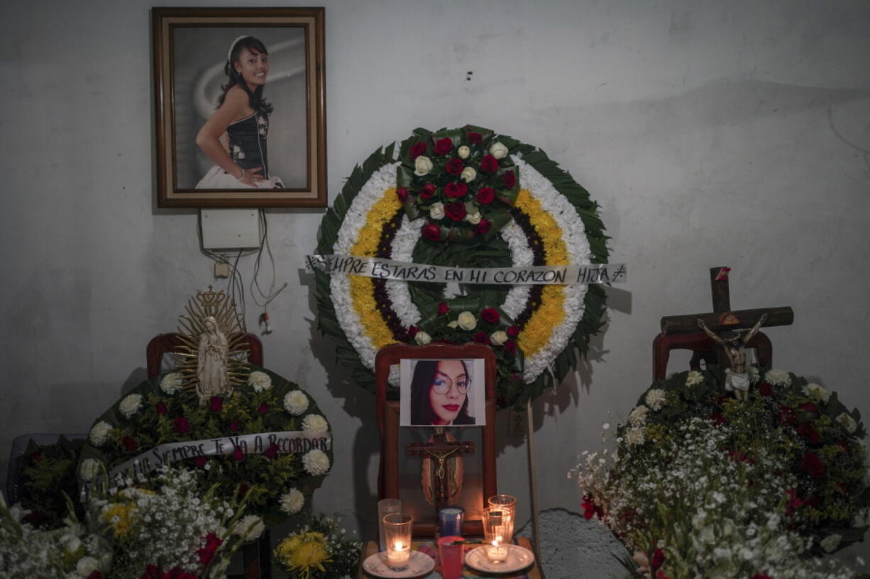 Photographs of Monica Citlalli Diaz are displayed during her wake inside her home in San Salvador Atenco, State of Mexico, Mexico, Thursday, Nov. 10, 2022. The 30-year-old English teacher became the ninth apparent femicide during an 11-day spate of killings in and around Mexico City from late October to early November.