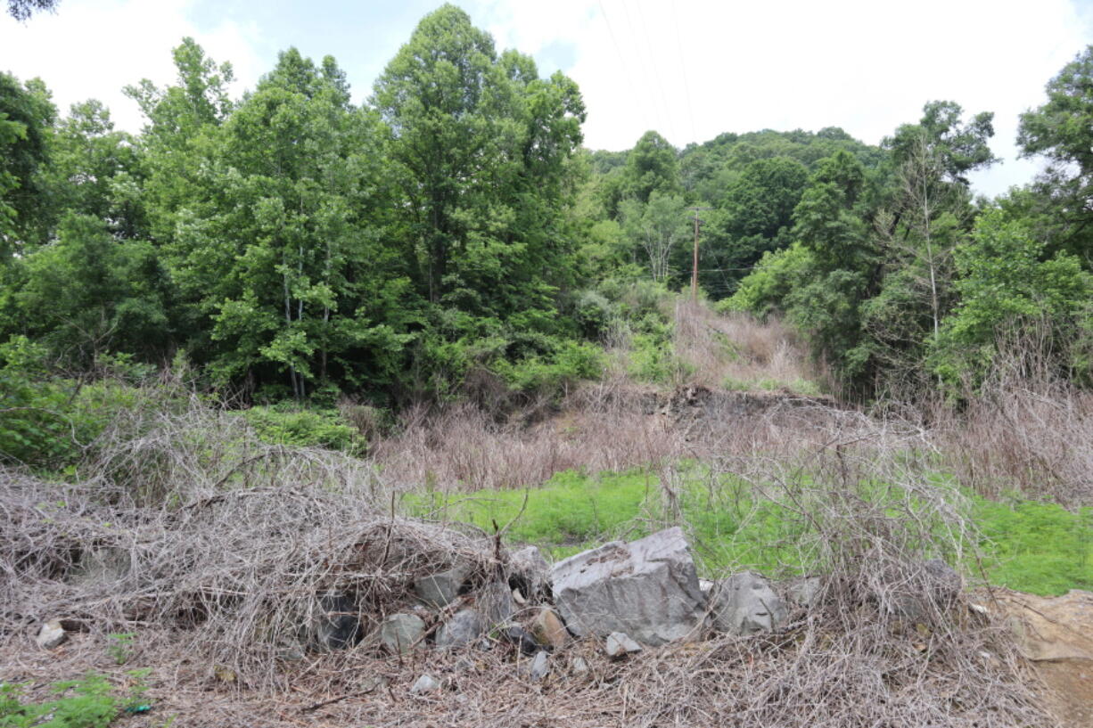 Ruins of an abandoned mine in Havaco, W.Va., nearby where more than 80 West Virginia coal miners who died in a mining disaster in 1912 are buried, is seen on June 7, 2022.