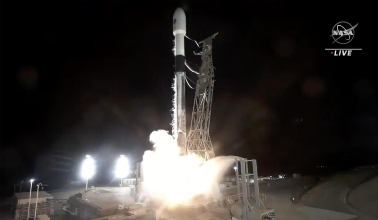 In this image made from video provided by NASA, a SpaceX rocket carrying the Surface Water and Ocean Topography satellite lifts off from Vandenberg Space Force Base in California, Friday, Dec. 16, 2022.