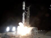 In this image made from video provided by NASA, a SpaceX rocket carrying the Surface Water and Ocean Topography satellite lifts off from Vandenberg Space Force Base in California, Friday, Dec. 16, 2022.