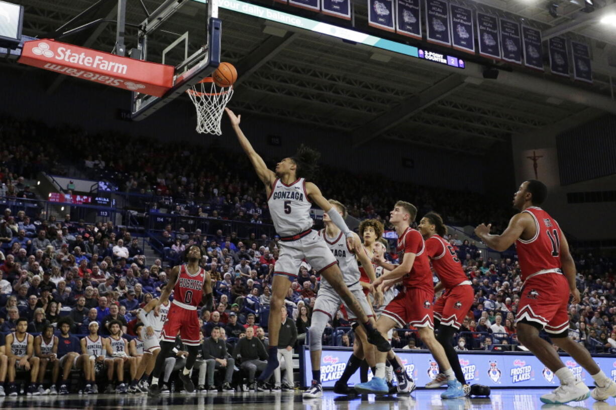 Gonzaga guard Hunter Sallis (5) shoots during the second half of a game against Northern Illinois on Monday, Dec. 12, 2022, in Spokane. The McCarthey Athletic Center on the Gonzaga campus is always sold out for basketball games and the Zags' brand recognition would be attractive for any major conference if Gonzaga were to leave the West Coast Conference.