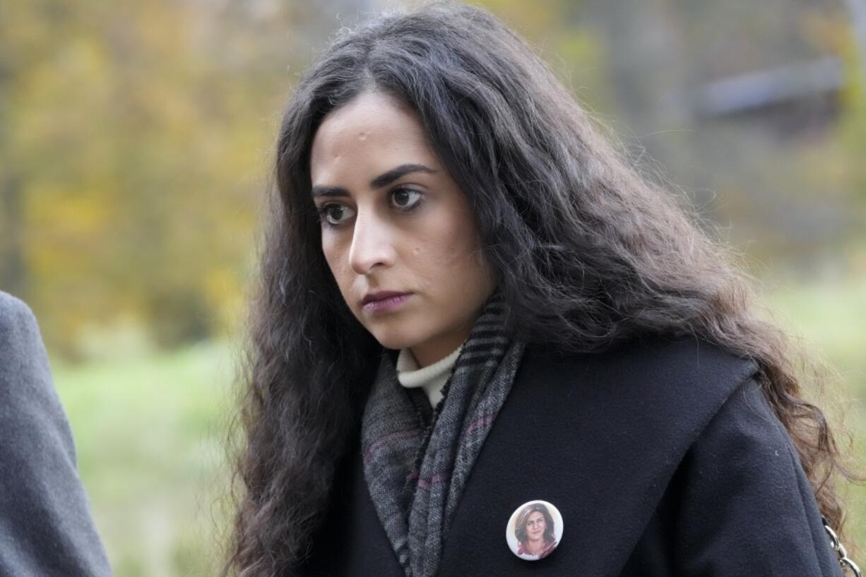 Lina Abu Akleh, niece of fatally shot Al Jazeera journalist Shireen Abu Akleh, waits outside the International Criminal Court in The Hague, Netherlands, Tuesday, Dec. 6, 2022, after Al Jazeera presented a letter requesting a formal investigation into the killing. Palestinian officials, Abu Akleh's family and Al Jazeera accuse Israel of intentionally targeting and killing the 51-year-old journalist, a claim Israel denies.