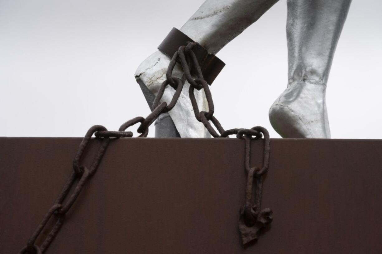 Clave, Monument for Slavery, by Alex da Silva, is seen in Rotterdam, Netherlands, Monday, Dec. 19, 2022. The Dutch government is expected to issue a long-awaited formal apology for its role in the slave trade, with a speech by Dutch Prime Minister Mark Rutte, and ceremonies in the former colonies.