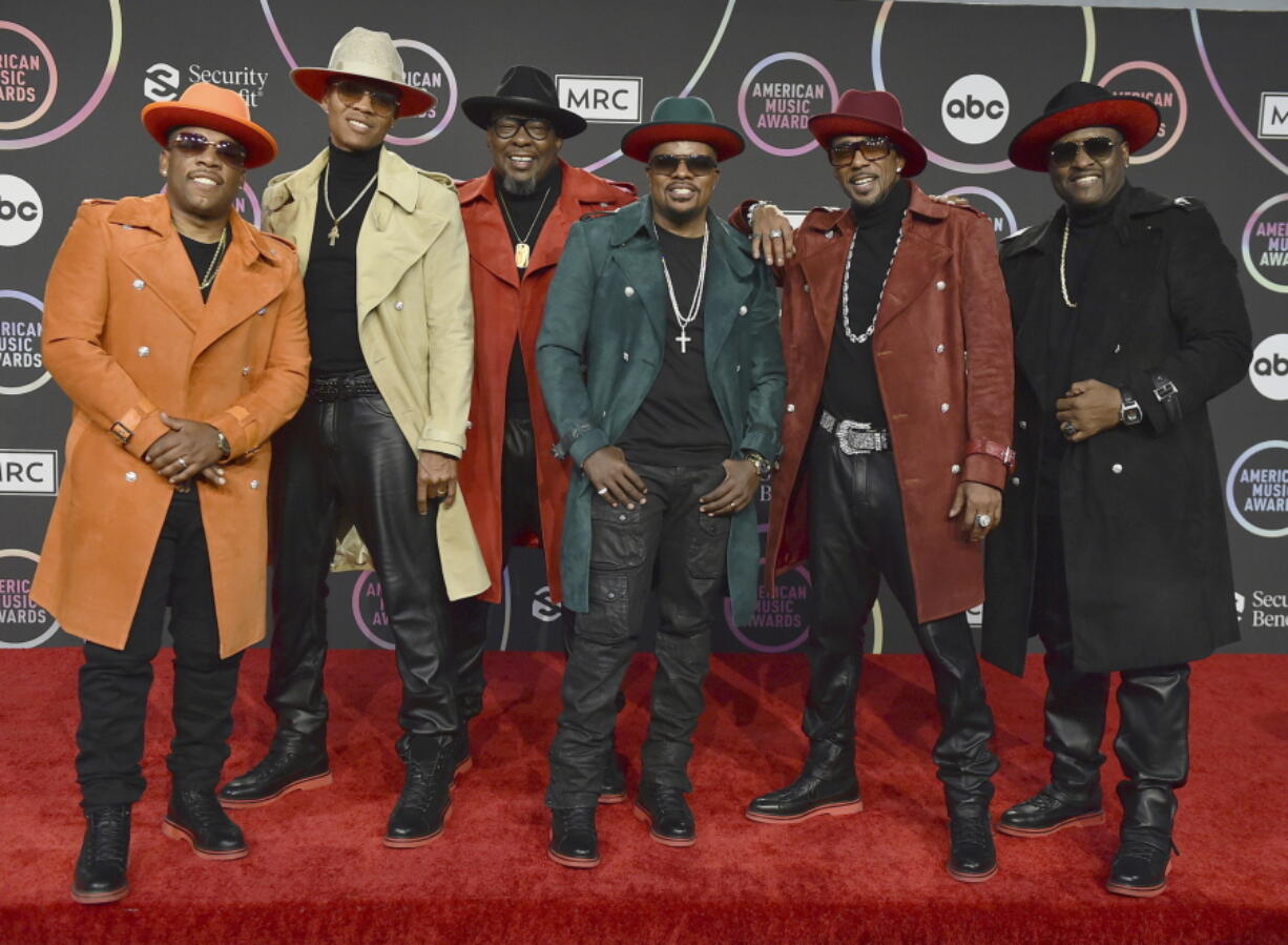 FILE - Michael Bivins, from left, Ronnie Devoe, Bobby Brown, Ricky Bell, Ralph Tresvant and Johnny Gill of New Edition appear in the press room at the American Music Awards in Los Angeles on Nov. 21, 2021.