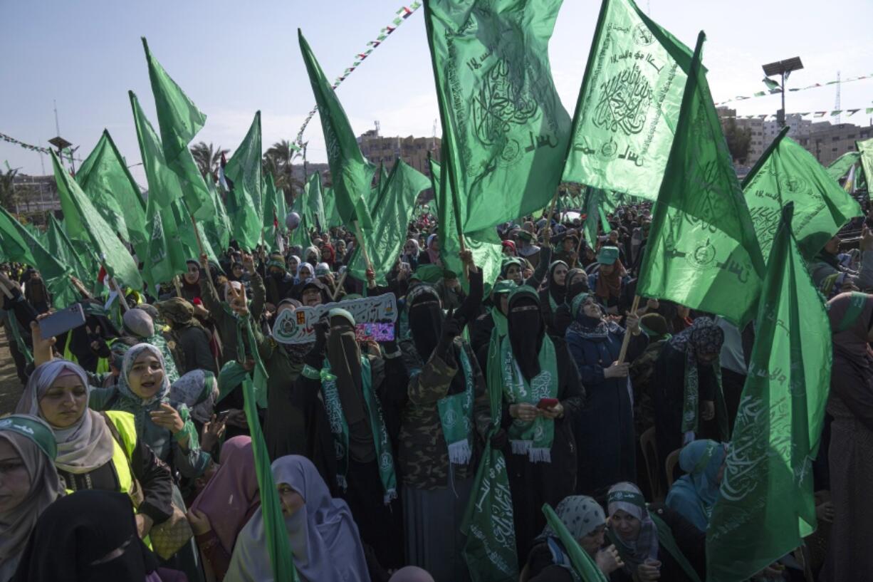 Palestinian women attend a rally marking the 35th anniversary of the Hamas movement's founding in Gaza City, Wednesday, Dec. 14, 2022. Hundreds of thousands of Palestinians thronged the rally in downtown Gaza to mark the founding of the militant group, as leaders predicted a year of "open confrontation" with the hardline Israeli government expected to take office in the coming days.