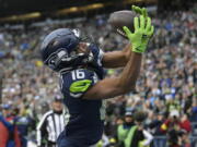 Seattle Seahawks wide receiver Tyler Lockett (16) broke a bone in his left hand on Thursday, Dec. 15, 2022, against the San Francisco 49ers. He remains hopeful to returning before the regular season is over.