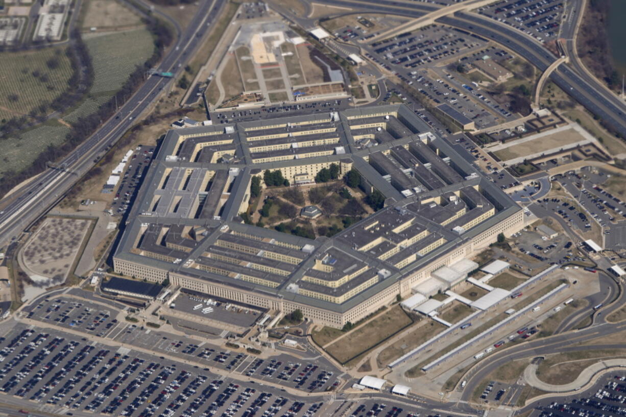 FILE - The Pentagon is seen from Air Force One as it flies over Washington, March 2, 2022. A new Pentagon office set up to track reports of unidentified flying objects has received "several hundreds" of new reports, but no evidence so far of alien life. That's according to the leadership of the All-domain Anomaly Resolution Office.