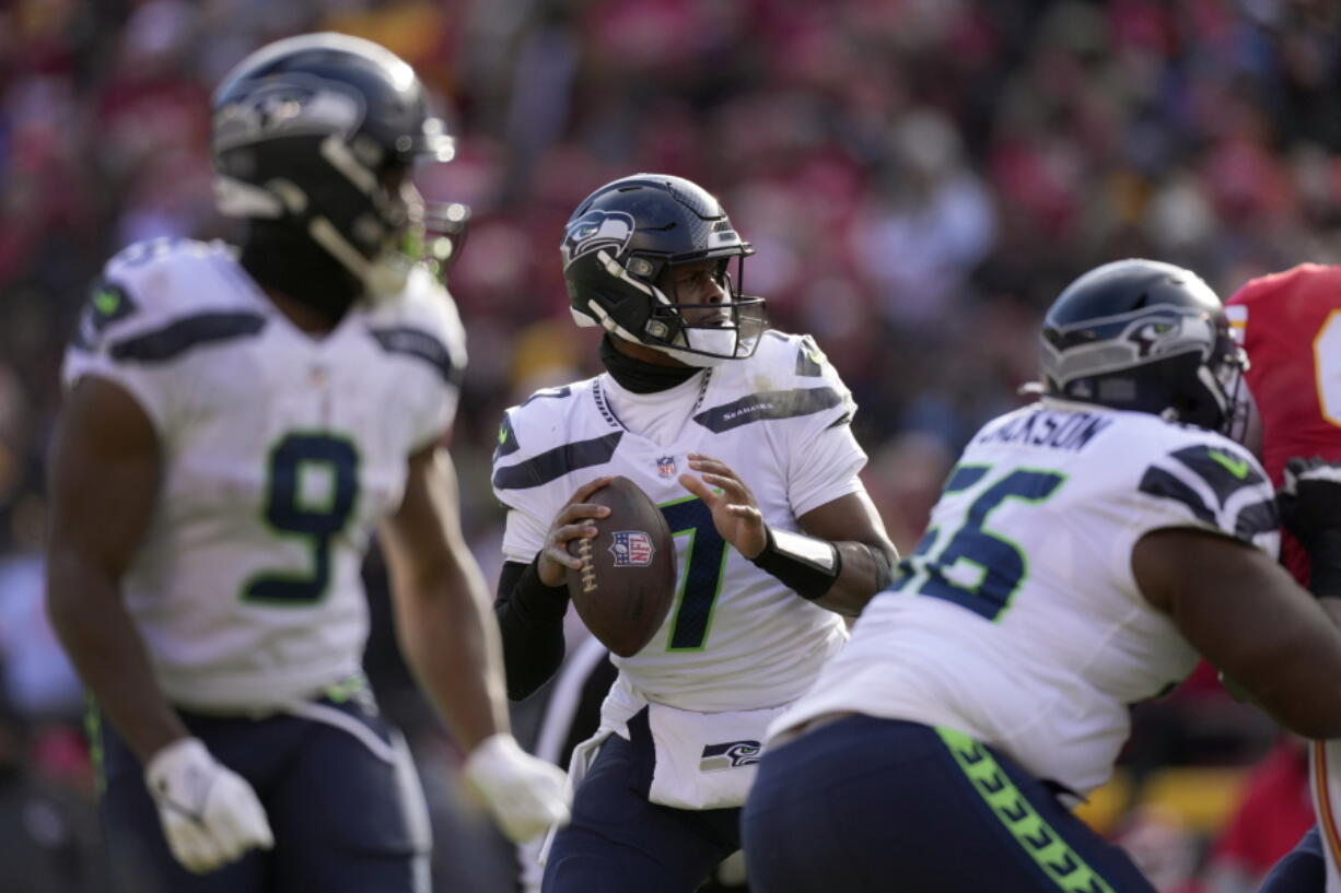 Seattle Seahawks quarterback Geno Smith (7) throws during the first half of an NFL football game against the Kansas City Chiefs Saturday, Dec. 24, 2022, in Kansas City, Mo.