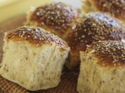 FILE - Sesame dinner rolls are photographed in Concord, N.H. on Oct. 12, 2015. A new federal law requiring that sesame be listed as an allergen on food labels is having unintended consequences _ increasing the number of products that include the ingredient. Starting Jan. 1, all foods made and sold in the U.S. must be labeled if they contain sesame, an often-hidden ingredient that's been declared the nation's ninth major allergen.