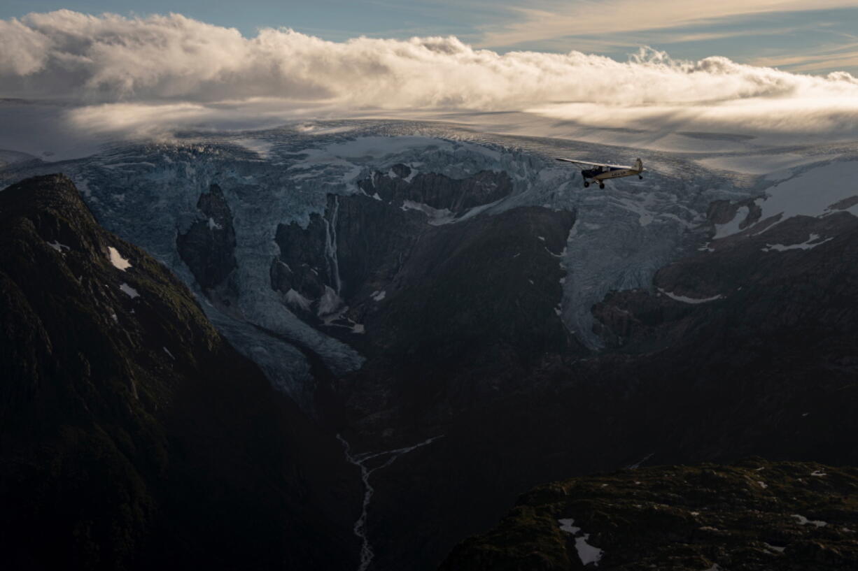 Aviator and adventurer Garrett Fisher flies his plane above the Folgefonna glacier in Norway, on Aug. 10, 2022. Fisher is on a mission to photograph all the remaining glaciers that are not in the polar regions before they disappear.