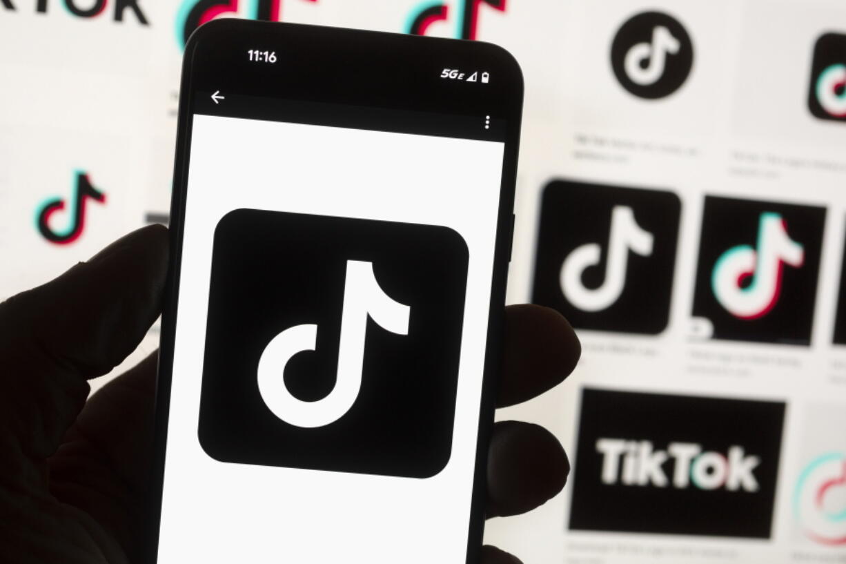 FILE - The TikTok logo is seen on a cell phone on Oct. 14, 2022, in Boston. New research finds that TikTok's powerful algorithms are promoting videos about self harm and eating disorders to teens. The findings come from the Center for Countering Digital Hate, which created TikTok accounts for fictitious young people living in the U.S., Britain, Canada and Australia.