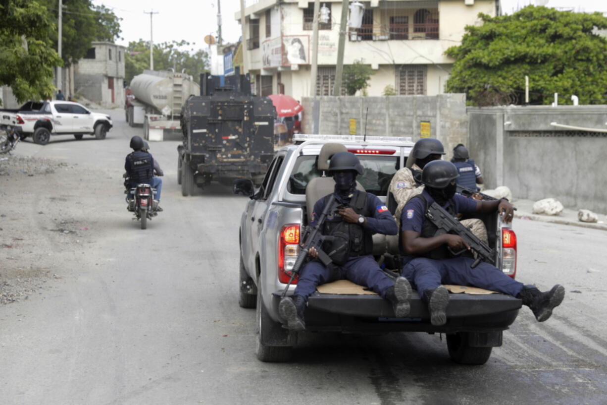 FILE - A police convoy escort fuel trucks filled with gas as they drive from the Varreux fuel terminal, in Port-au-Prince, Haiti, on Nov. 8, 2022. U.N. Deputy Secretary-General Amina Mohammed, speaking to the U.N. Security Council on Wednesday, Dec. 21, 2022, urged countries to urgently consider Haiti's request for an international armed force to help restore security in the country troubled by gang violence. A U.N.