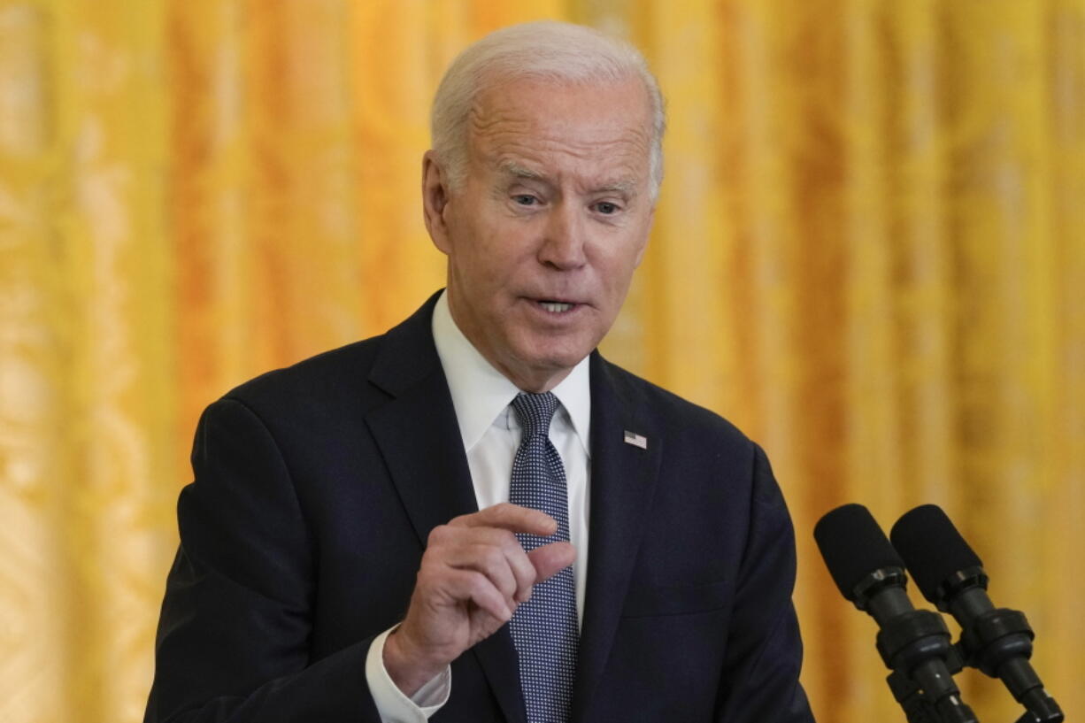 President Joe Biden speaks during a news conference with French President Emmanuel Macron in the East Room of the White House in Washington, Thursday, Dec. 1, 2022.