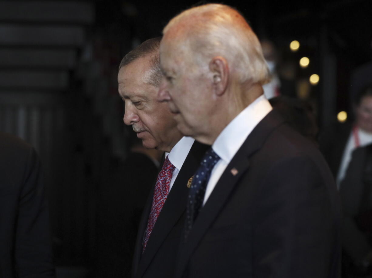 FILE - Turkish President Recep Tayyip Erdogan, left, walks with U.S. President Joe Biden during the G20 leaders' summit in Nusa Dua, Bali, Indonesia, Nov. 15, 2022. Biden administration officials are toughening their language toward NATO ally Turkey as they try to talk Turkish President Recep Erdogan out of launching a bloody and destabilizing ground offensive against American-allied Kurdish forces in neighboring Syria.