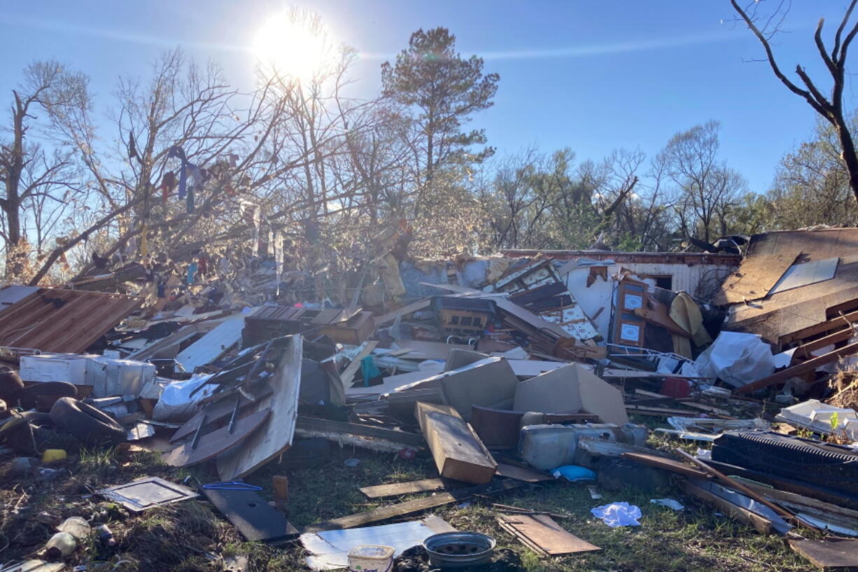 Debris is piled up following severe weather Wednesday, Dec. 14, 2022, in Keithville, La. A volatile storm ripping across the U.S. spawned tornadoes that killed a young boy and his mother in Louisiana, smashed mobile homes and chicken houses in Mississippi and threatened neighboring Southern states with more punishing weather Wednesday.